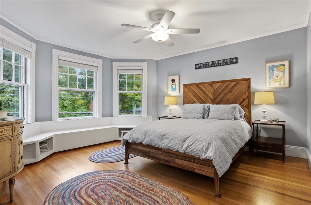45 Walnut Road Hamilton, MA 01982 - Photo 22 of 40 a bedroom with a bed and a large window with wooden floor
