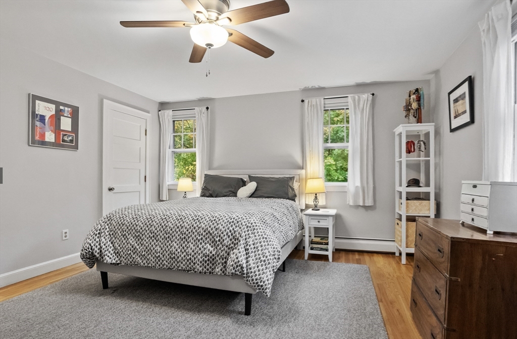 45 Walnut Road Hamilton, MA 01982 - Photo 27 of 40 a bedroom with a bed and a chandelier