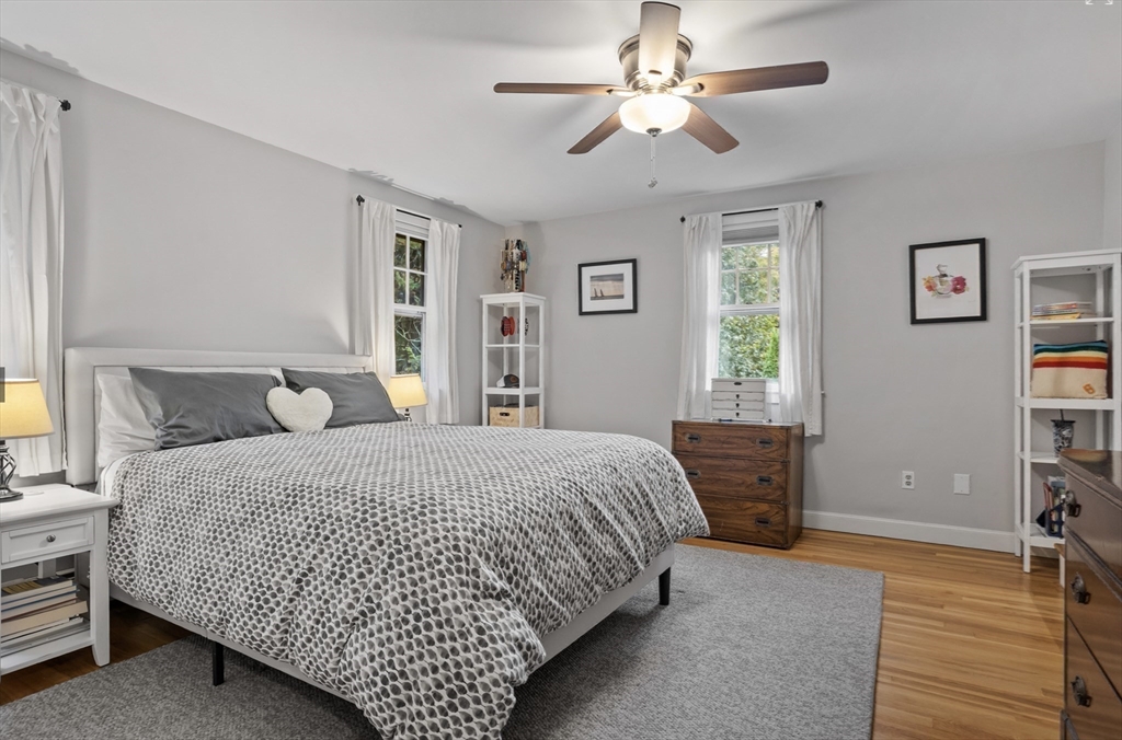 45 Walnut Road Hamilton, MA 01982 - Photo 28 of 40 a bedroom with a bed and a chandelier