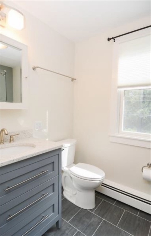 45 Walnut Road Hamilton, MA 01982 - Photo 29 of 40 a bathroom with a granite countertop toilet sink and a mirror