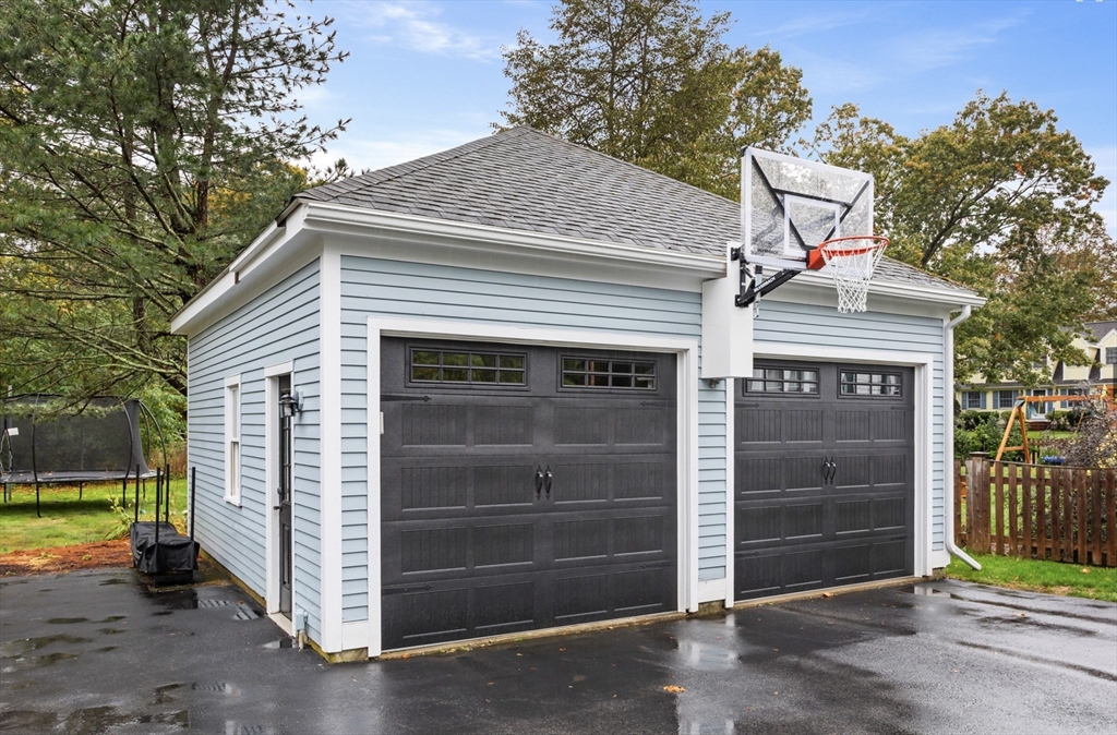 45 Walnut Road Hamilton, MA 01982 - Photo 40 of 40 a front view of a house with a yard and garage