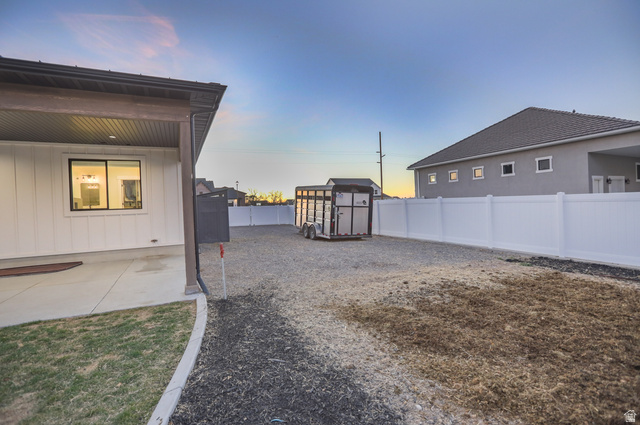 126 North 800 West Mapleton, UT 84664 - Photo 72 of 79 Yard at dusk with a storage shed and a fenced backyard