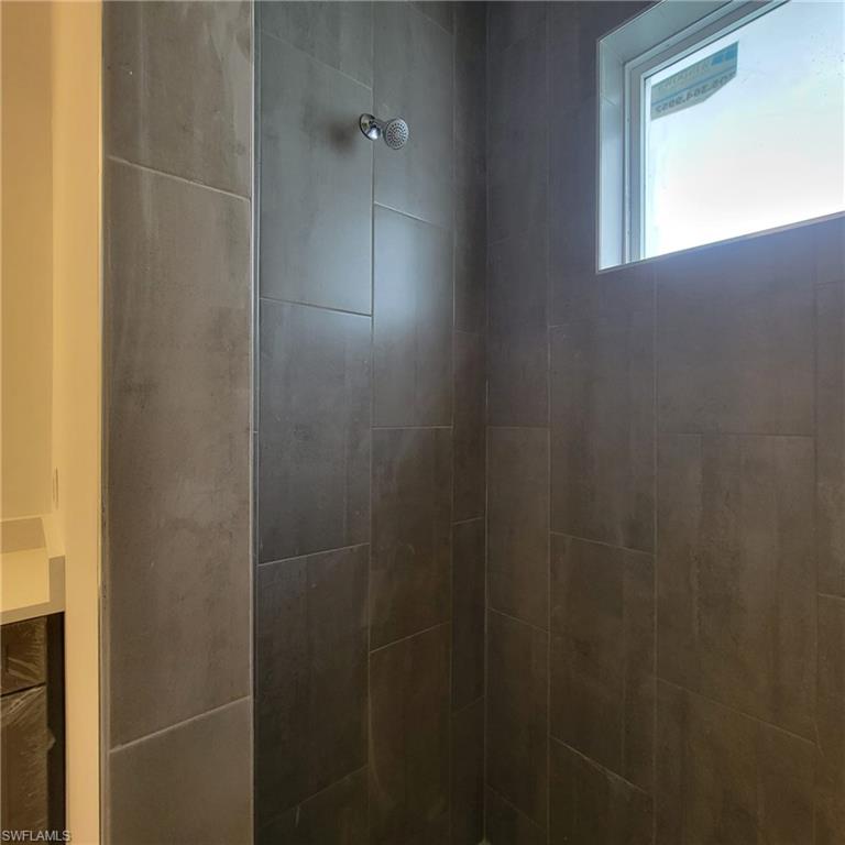 1900 West 16th Street Lehigh Acres, FL 33972 - Photo 17 of 21 a bathroom with a shower