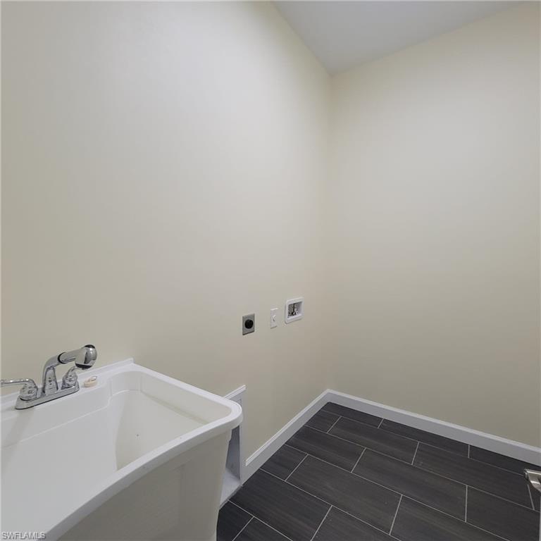 1900 West 16th Street Lehigh Acres, FL 33972 - Photo 18 of 21 a bathroom with a bathtub