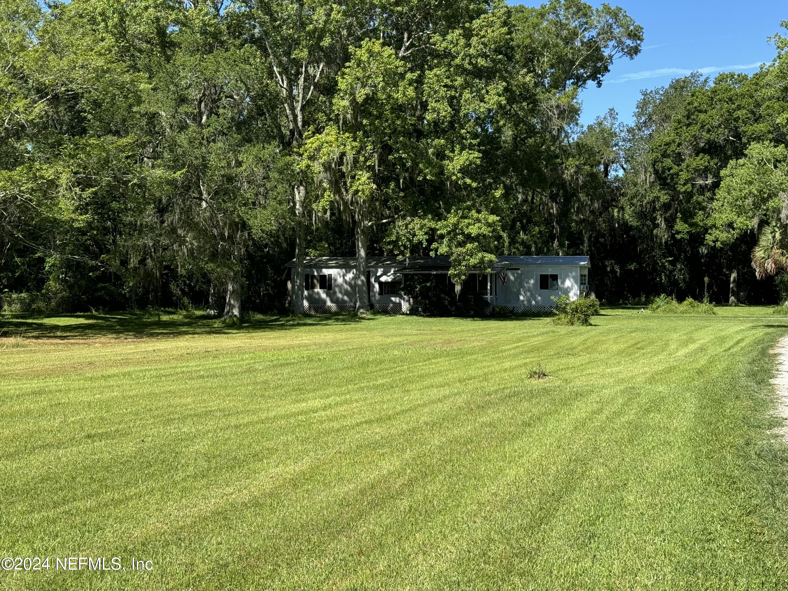 2015 Powell Road St. Augustine, FL 32084 - Photo 5 of 8 a view of swimming pool with trees