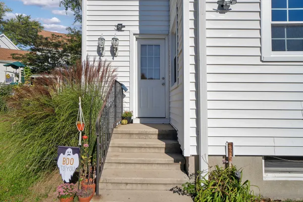 a view of a house with a potted plant
