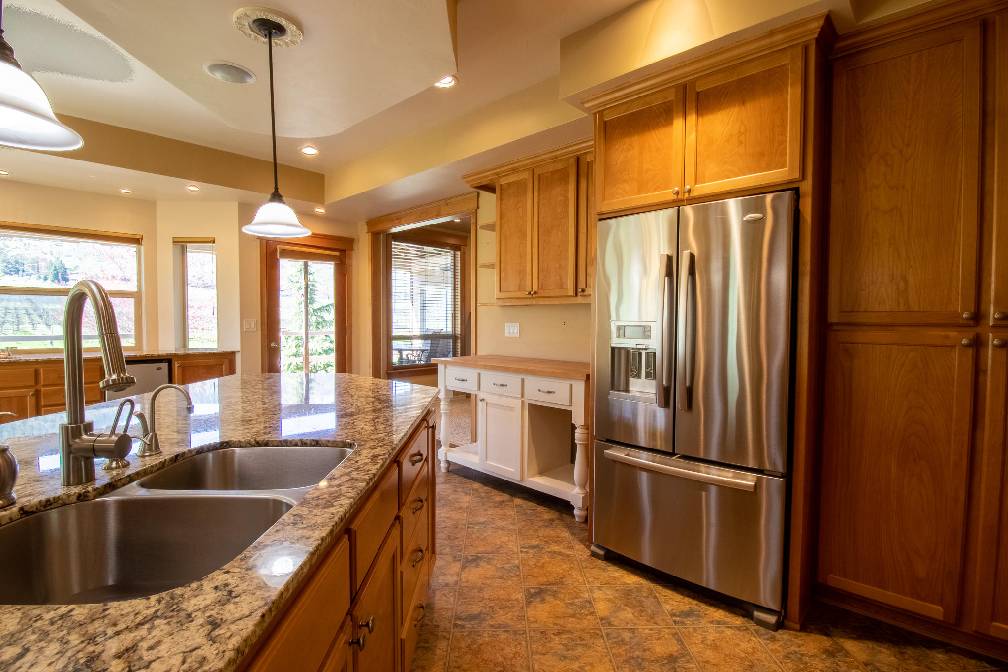1381 Foss Road Talent, OR 97540 - Photo 12 of 41 Beautiful tile and granite kitchen with loads of cabinetry and built-ins