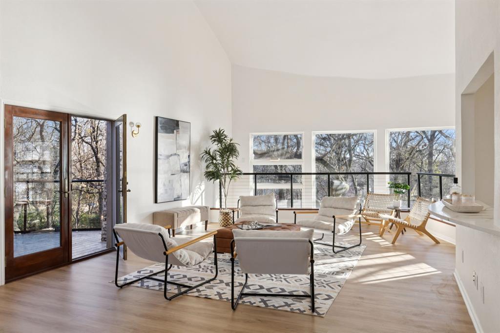 540 Diamond Point Drive Oak Point, TX 75068 - Photo 20 of 27 Living room with high vaulted ceiling, plenty of natural light, and light wood-type flooring