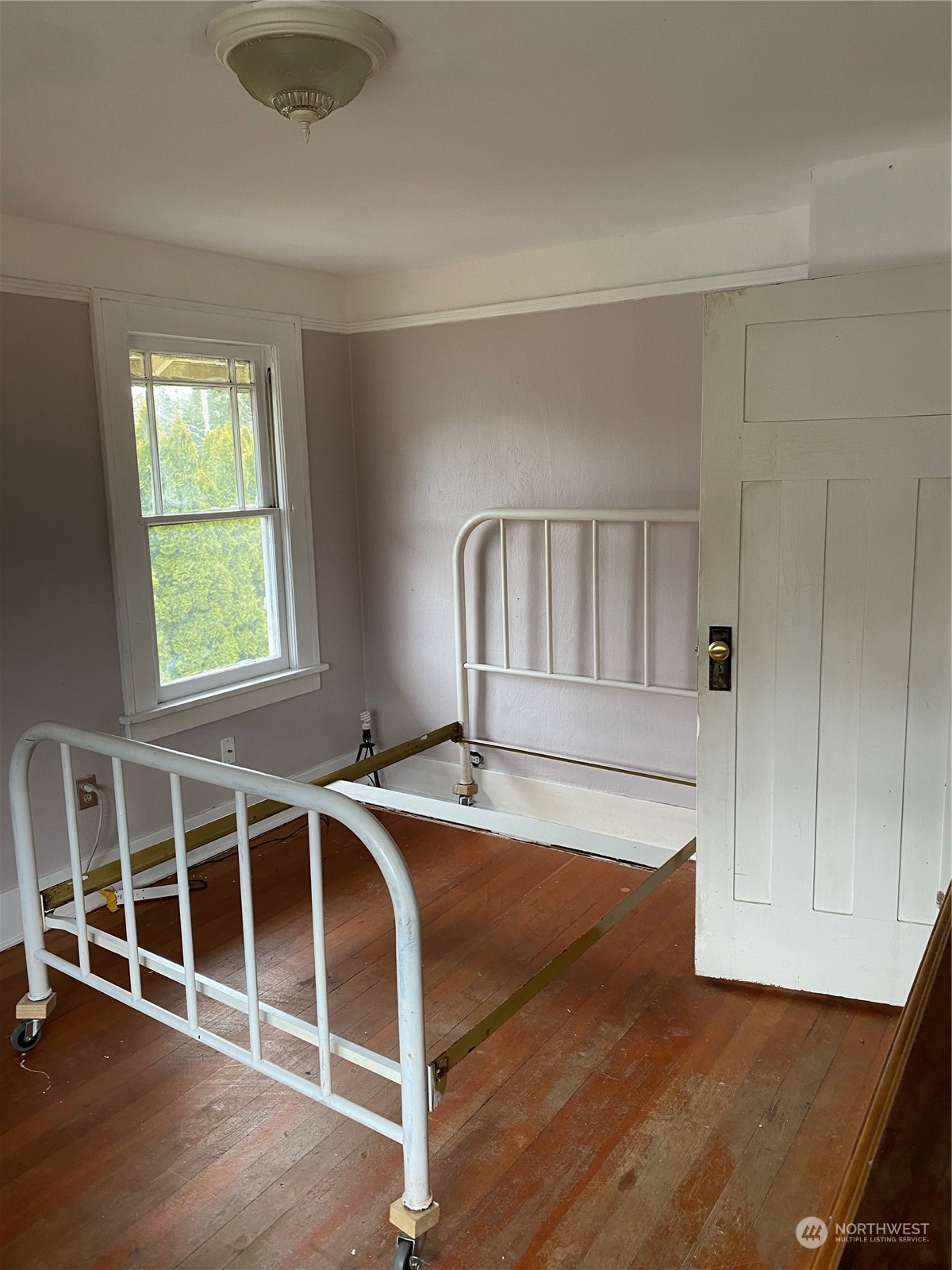 23304 Bothell Everett Highway Bothell, WA 98021 - Photo 17 of 35 a view of an empty room with wooden floor and windows