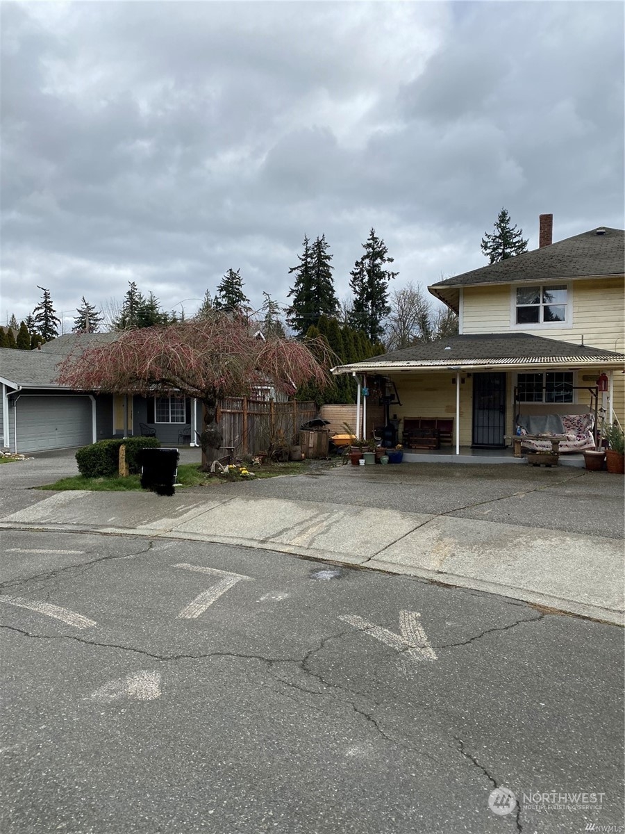 23304 Bothell Everett Highway Bothell, WA 98021 - Photo 3 of 35 a front view of a house with a yard and garage