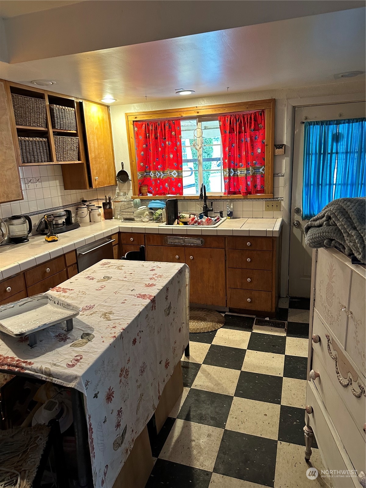 23304 Bothell Everett Highway Bothell, WA 98021 - Photo 4 of 35 a kitchen with a sink stove top oven and cabinets
