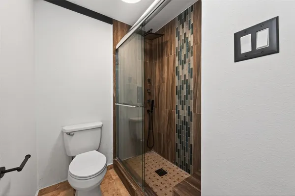 a view of a room with window and ceiling fan