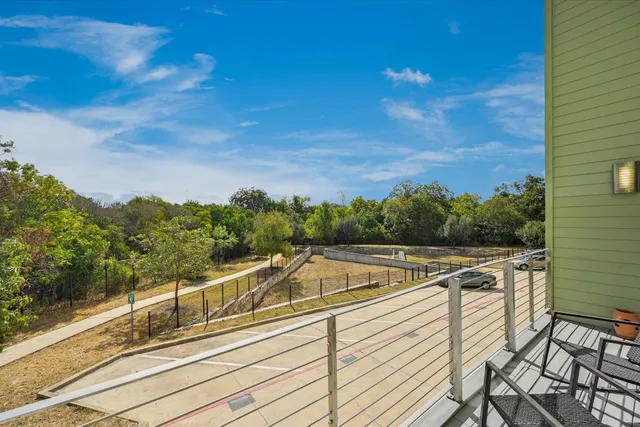 a view of a balcony with chairs