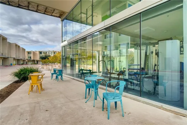 a view of a swimming pool with a patio