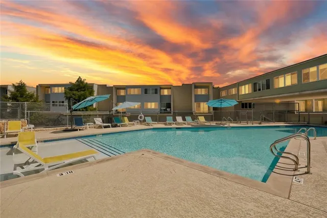 a view of a yard with swimming pool