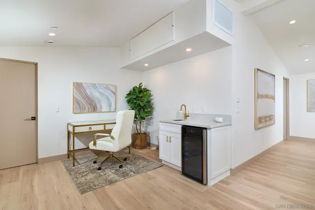 a living room with furniture a dining table and kitchen view