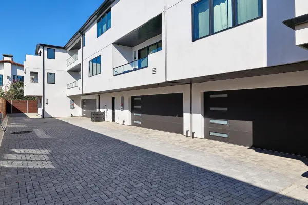a front view of a house with garage