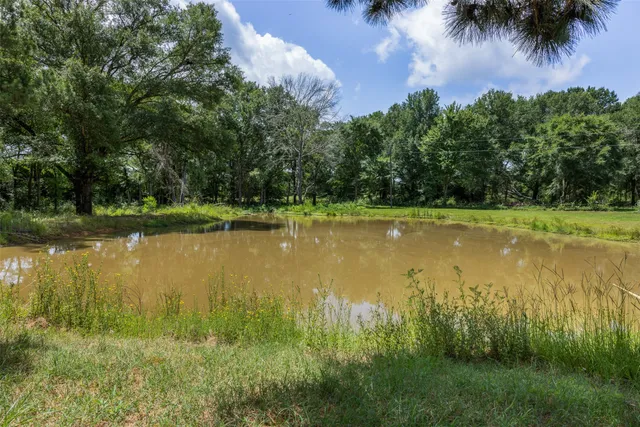 a view of a lake with a big yard
