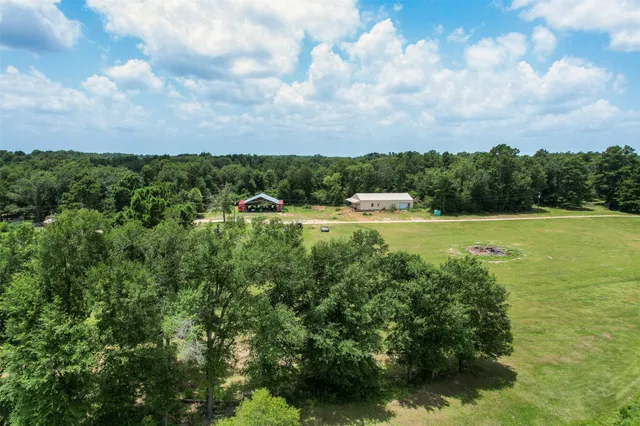 a view of a lake with houses in the back