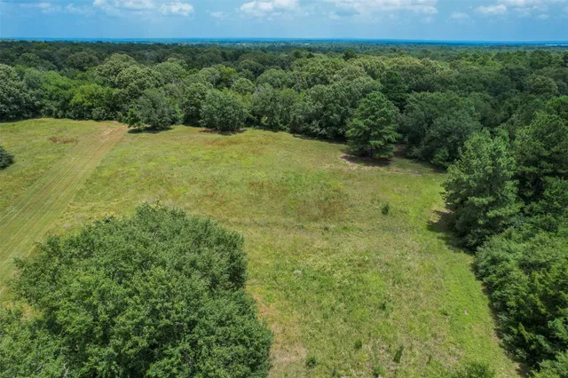 a view of a field with an outdoor space