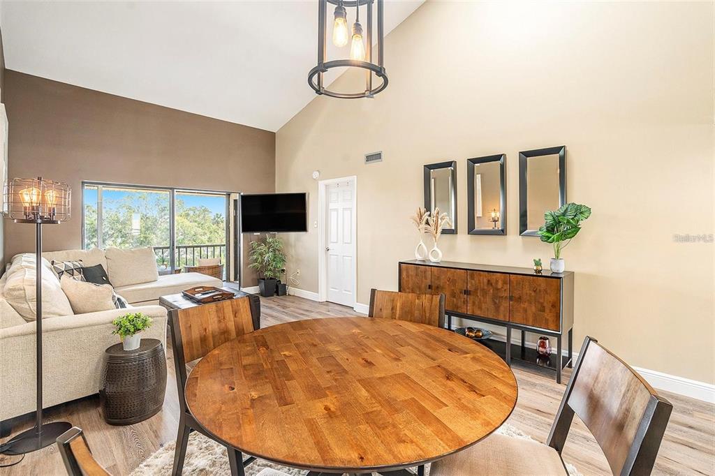 8210 Aquila Street, Unit 223 Port Richey, FL 34668 - Photo 18 of 36 a room with furniture and flat screen tv