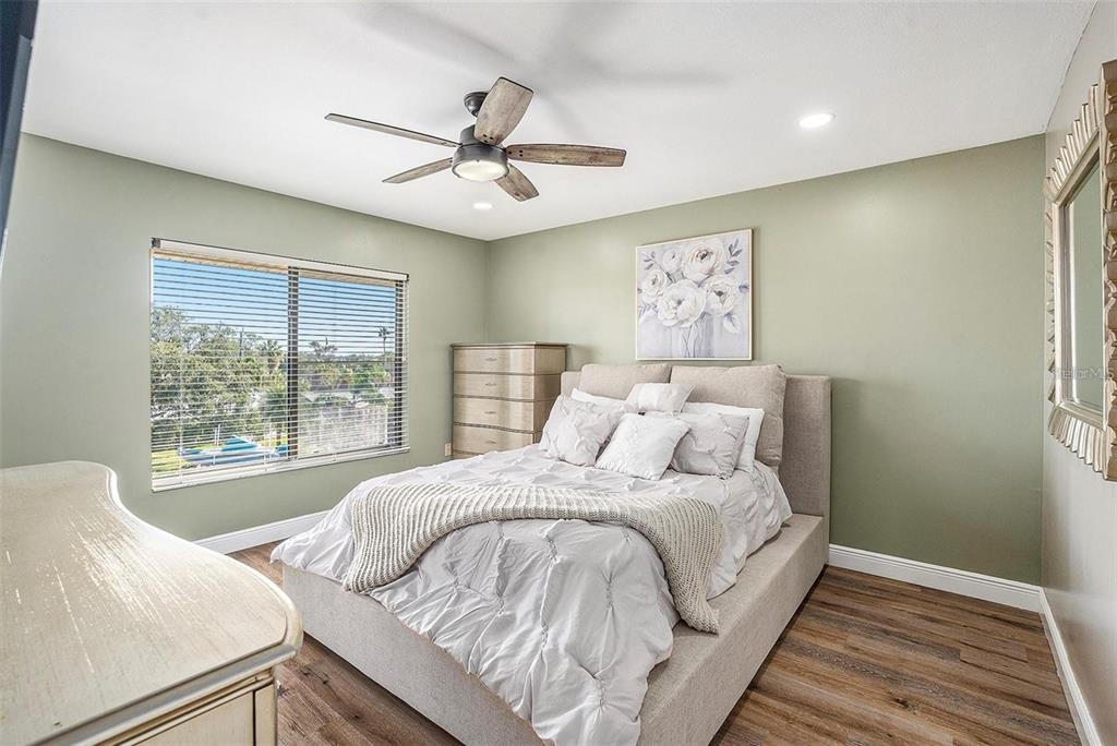 8210 Aquila Street, Unit 223 Port Richey, FL 34668 - Photo 19 of 36 a bedroom with a large bed and a window
