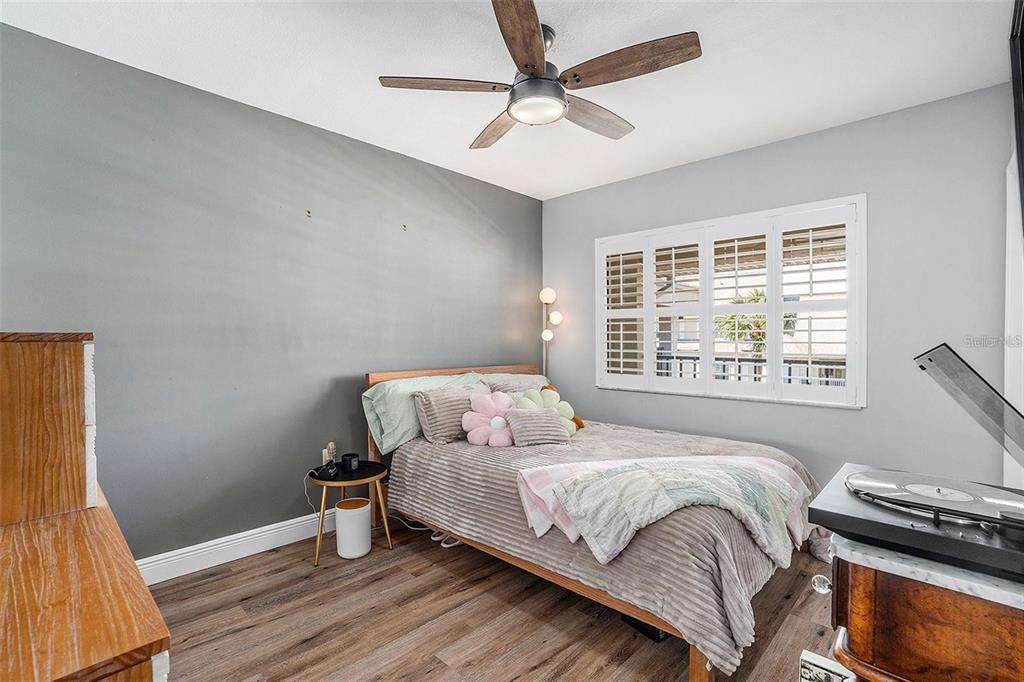 8210 Aquila Street, Unit 223 Port Richey, FL 34668 - Photo 23 of 36 a bedroom with a bed and a window