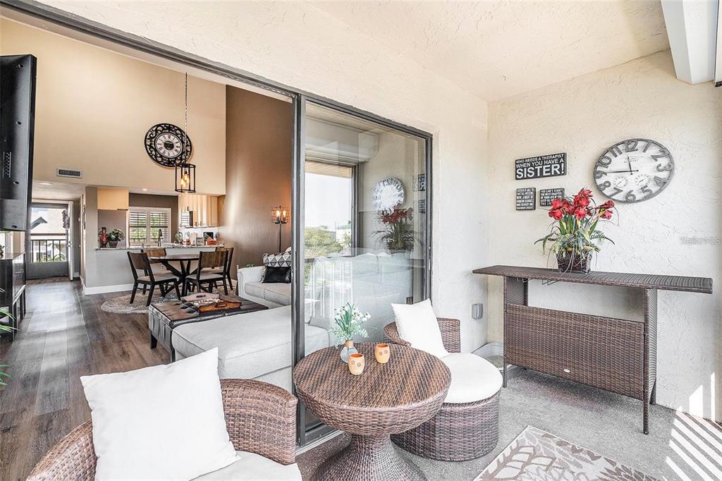 8210 Aquila Street, Unit 223 Port Richey, FL 34668 - Photo 26 of 36 a living room with furniture and a table