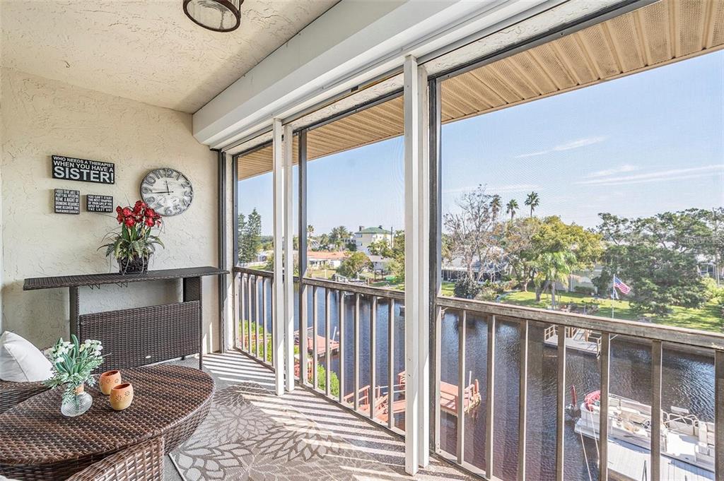 8210 Aquila Street, Unit 223 Port Richey, FL 34668 - Photo 27 of 36 a living room with furniture and a large window