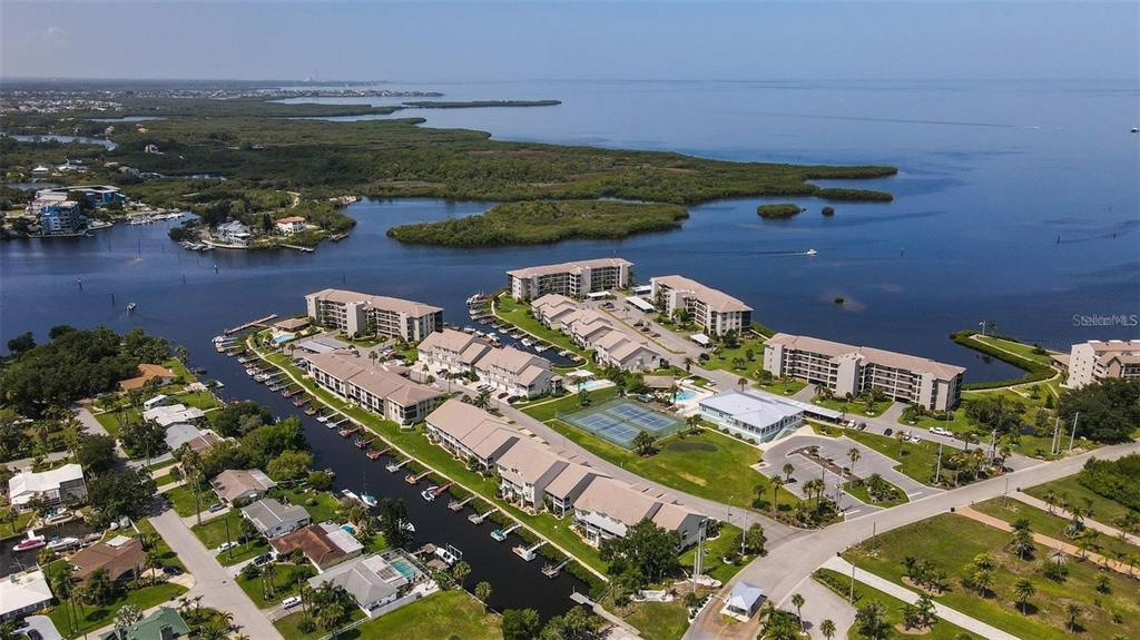 8210 Aquila Street, Unit 223 Port Richey, FL 34668 - Photo 31 of 36 an aerial view of a residential houses with outdoor space