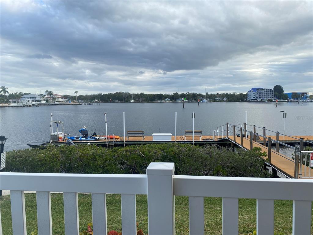 8210 Aquila Street, Unit 223 Port Richey, FL 34668 - Photo 32 of 36 a view of a lake with a garden