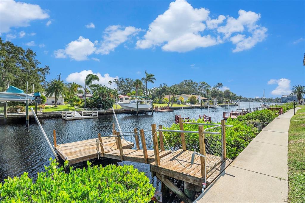 8210 Aquila Street, Unit 223 Port Richey, FL 34668 - Photo 34 of 36 a view of a lake with a house