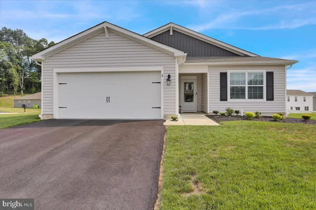 a front view of house with yard