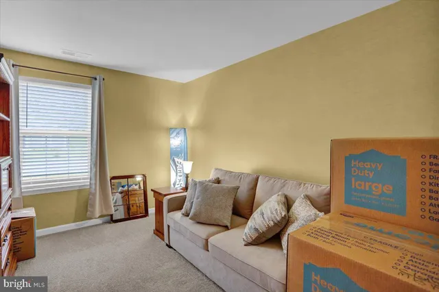 a view of an empty room and workspace