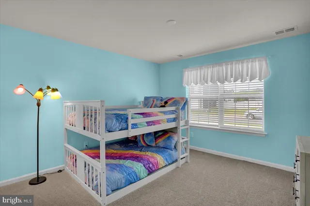 a bedroom with bunk bed
