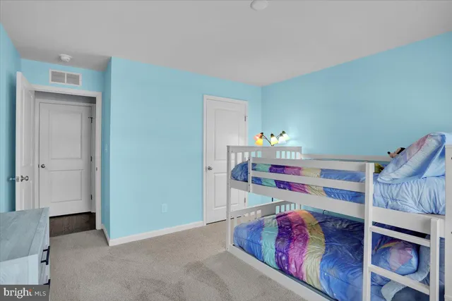 a bathroom with a sink shower and a mirror