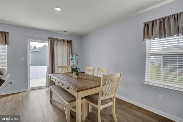 a view of a dining table and chairs in a room