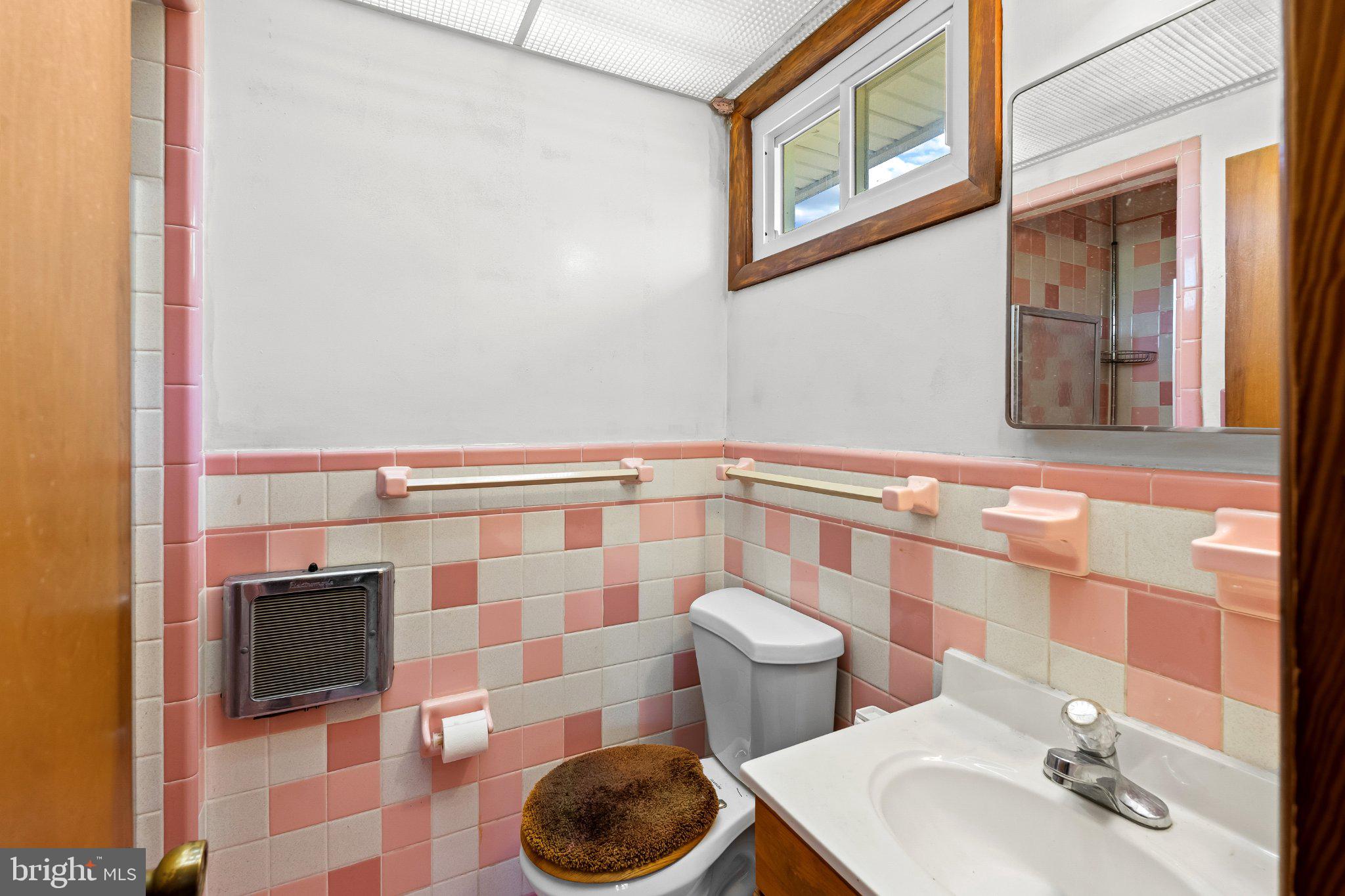 5422 Woodbine Road Woodbine, MD 21797 - Photo 21 of 39 Charming retro bathroom with pastel tiles.