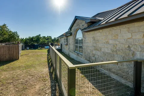 a view of balcony with wooden floor and fence