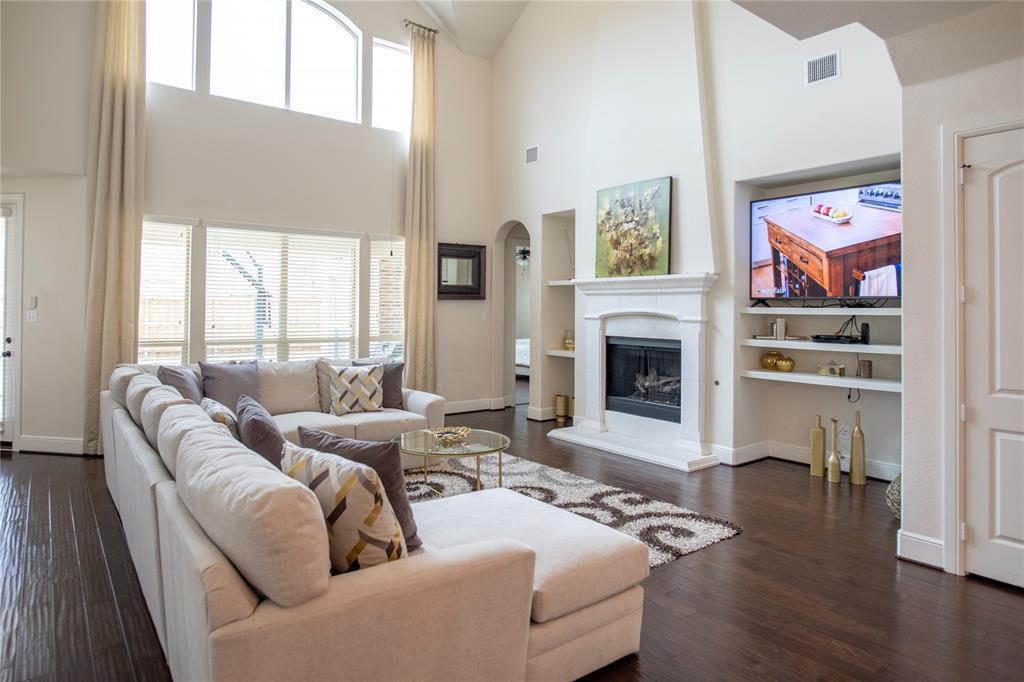 a living room with furniture fireplace and window