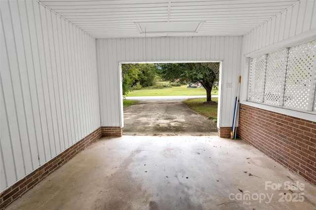 a view of an empty room with a fireplace