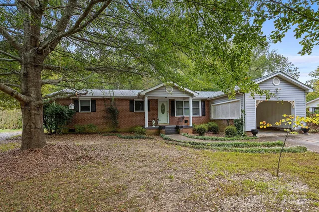 a backyard of a house with seating space
