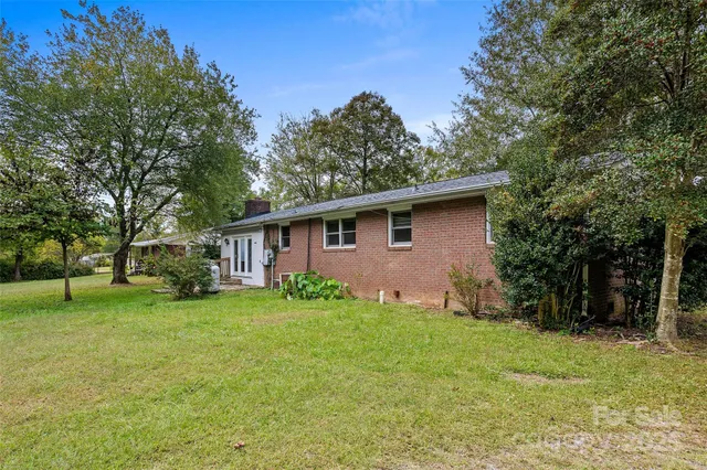 a view of a backyard with a cabin