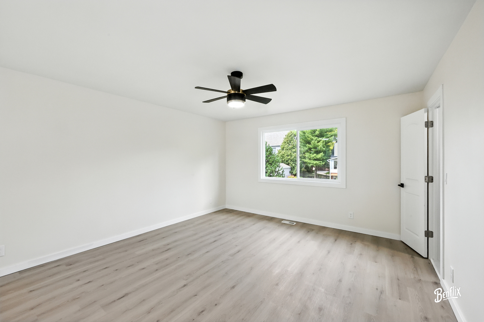318 Exmoor Drive Streamwood, IL 60107 - Photo 12 of 26 an empty room with windows and ceiling fan