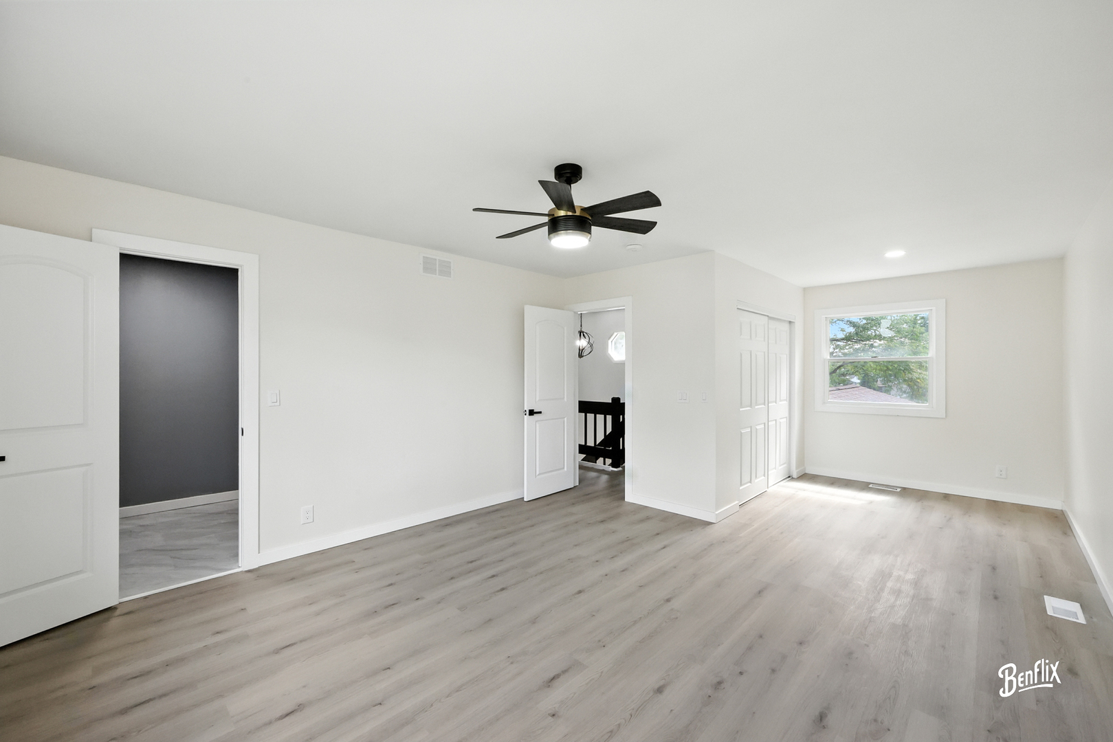 318 Exmoor Drive Streamwood, IL 60107 - Photo 13 of 26 wooden floor in an empty room with a window