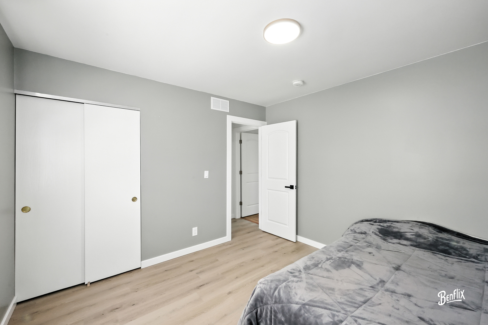 318 Exmoor Drive Streamwood, IL 60107 - Photo 15 of 26 a bedroom with a bed and wooden floor