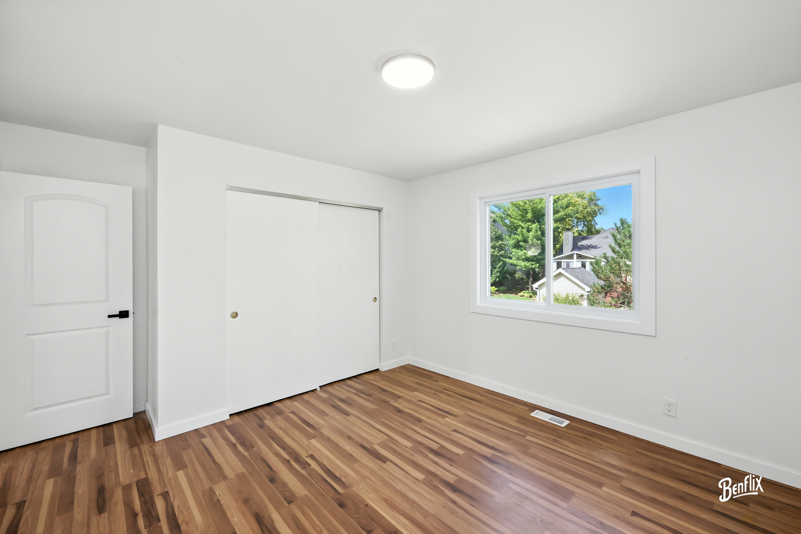 318 Exmoor Drive Streamwood, IL 60107 - Photo 16 of 26 wooden floor in an empty room with a window