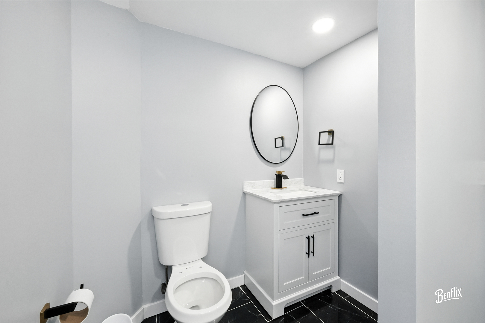 318 Exmoor Drive Streamwood, IL 60107 - Photo 19 of 26 a bathroom with a toilet a sink and a mirror