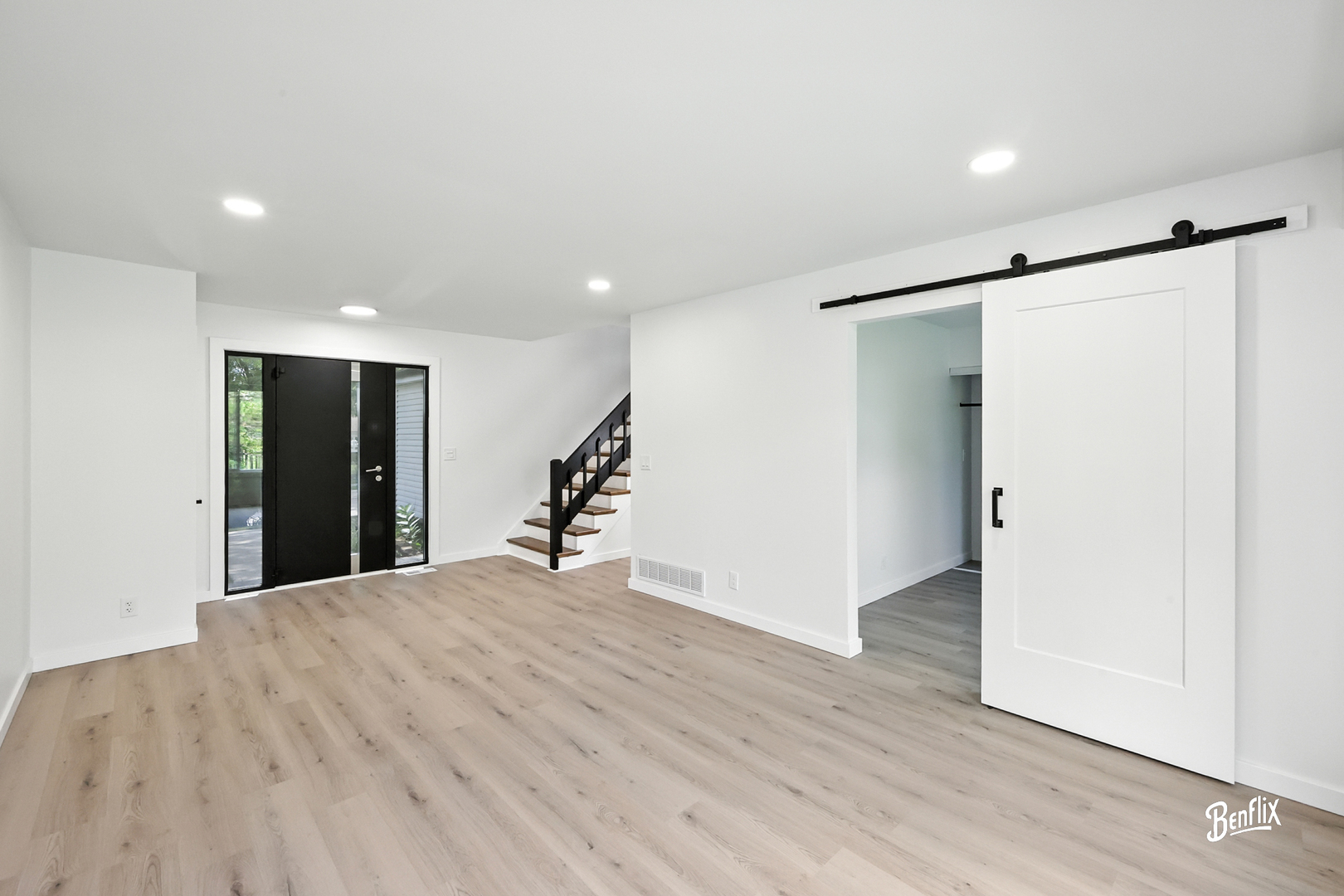 318 Exmoor Drive Streamwood, IL 60107 - Photo 3 of 26 a view of an empty room with wooden floor and a window