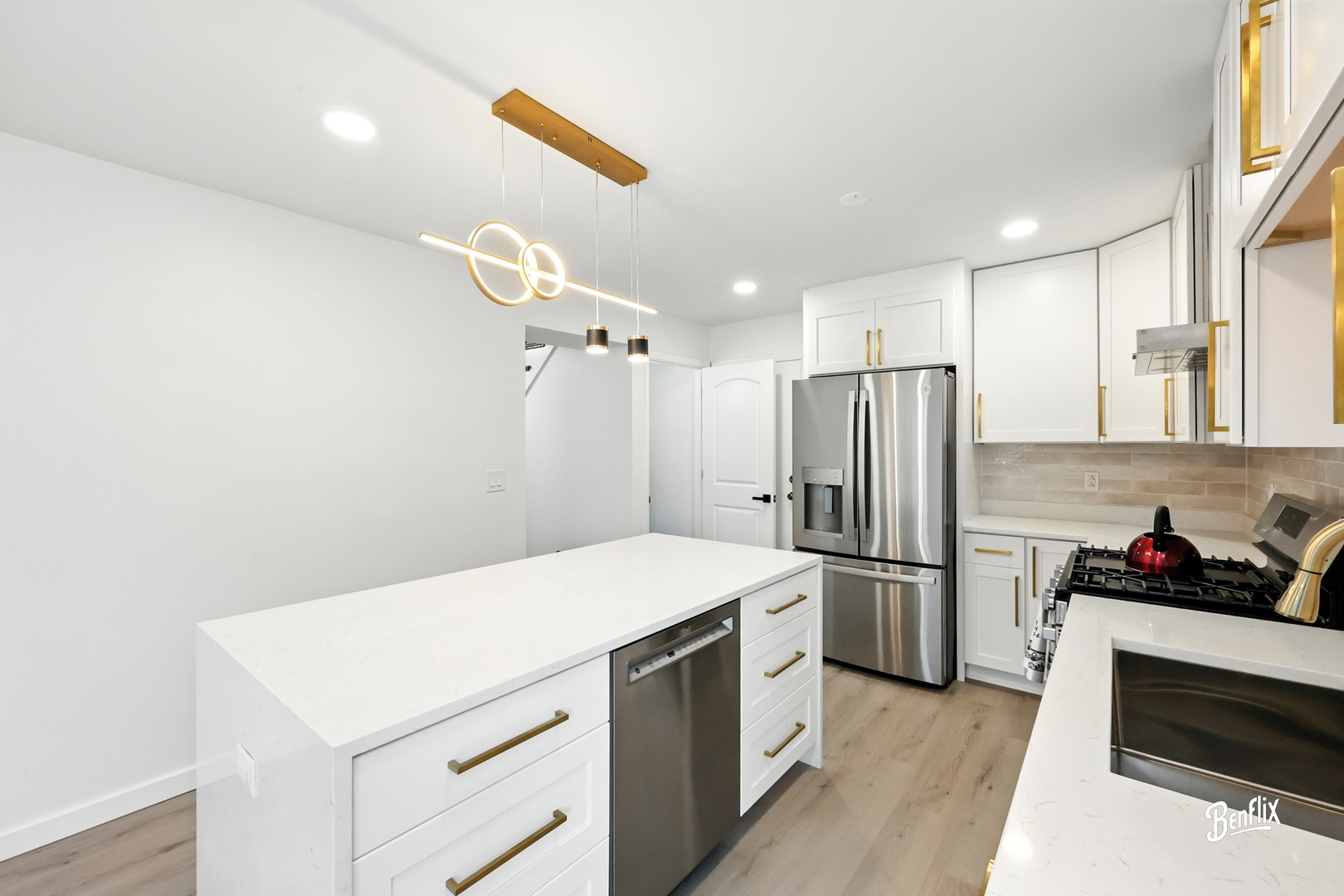 318 Exmoor Drive Streamwood, IL 60107 - Photo 7 of 26 a kitchen with a refrigerator and a sink